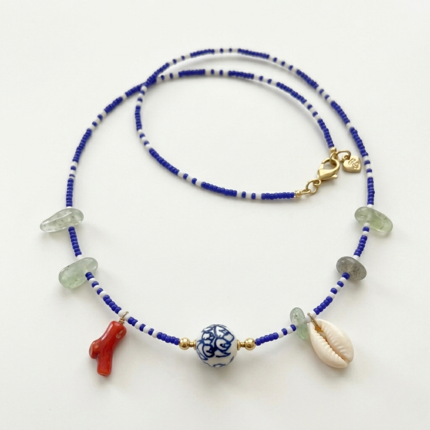 Royal Blue & White Beaded Charm Necklace - Chinoiserie Ceramic Bead, Red Coral, and Cowrie Shell - Handmade Boho Statement Jewelry